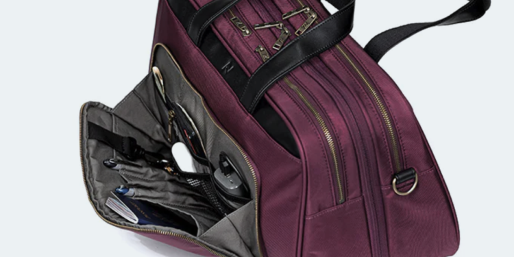a purple bag with a black handle