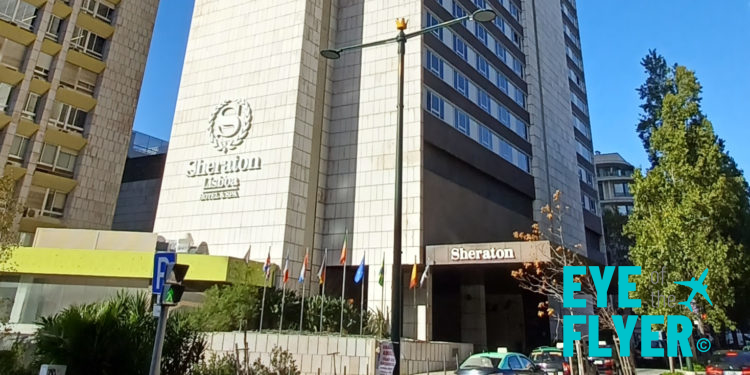 a building with flags on the side