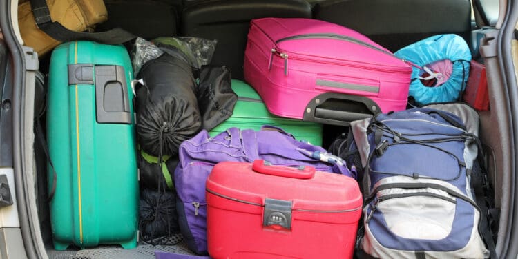a group of luggage in the back of a car