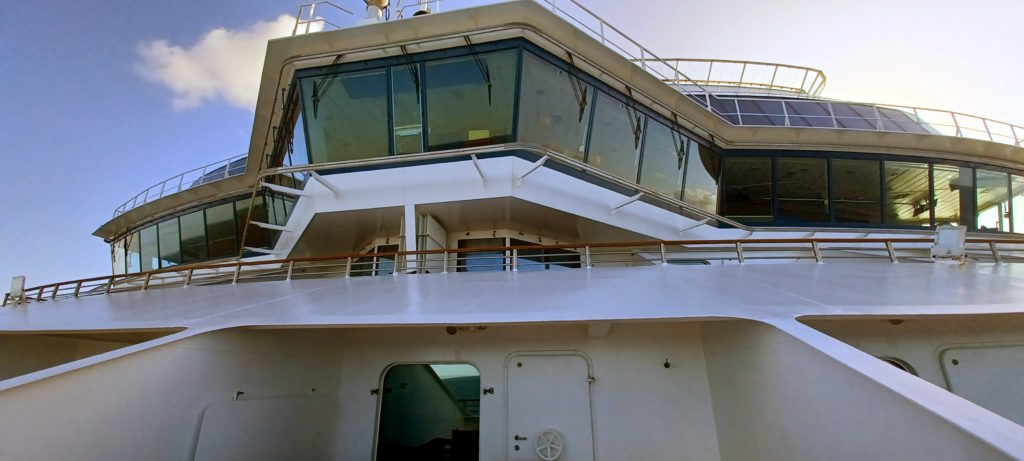 a large white ship with a balcony