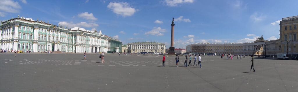 a group of people walking in a plaza