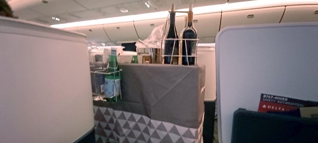 bottles on a shelf in an airplane