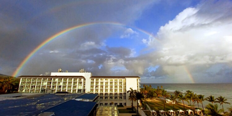 a rainbow over a building