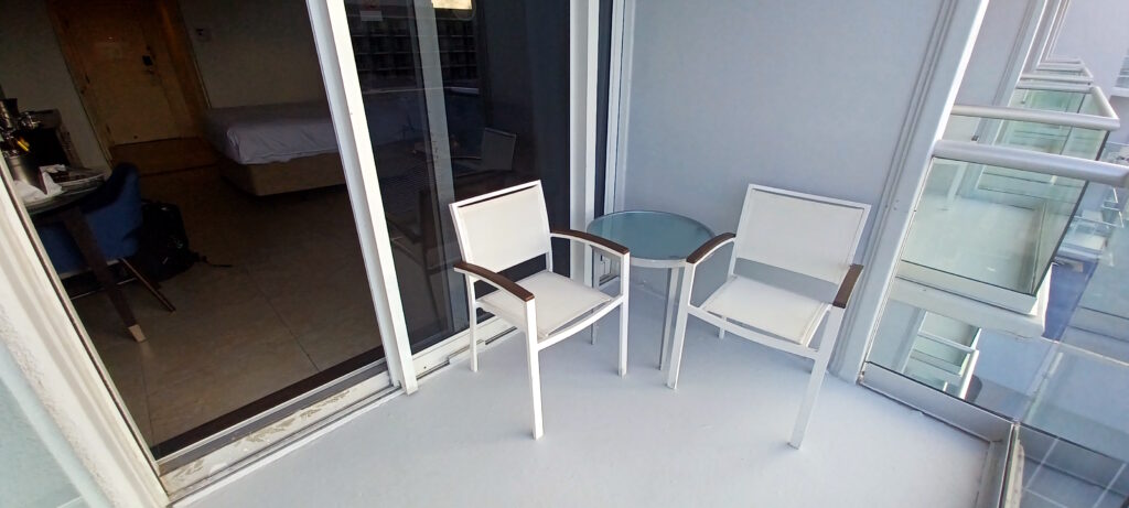a white chairs and a glass table