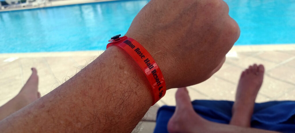 a person wearing a red wristband