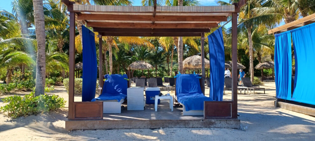 a beach chair under a canopy