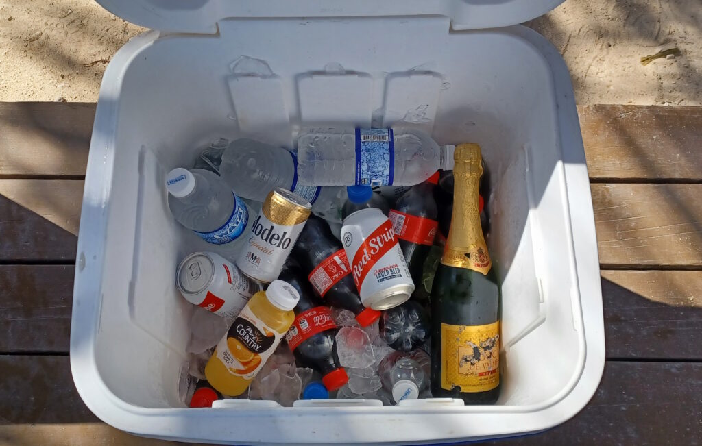 a cooler full of bottles and ice
