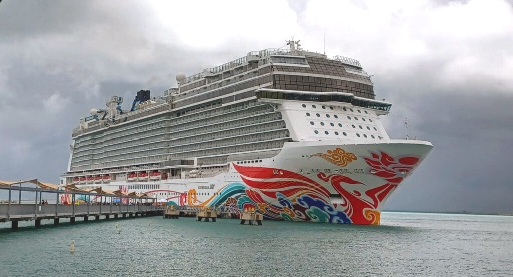 a cruise ship docked at a dock