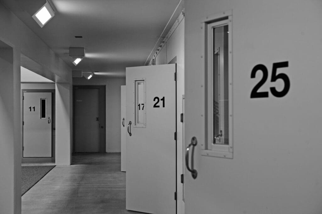 a hallway with doors and numbers