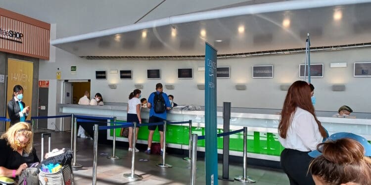 people standing in a line at a counter