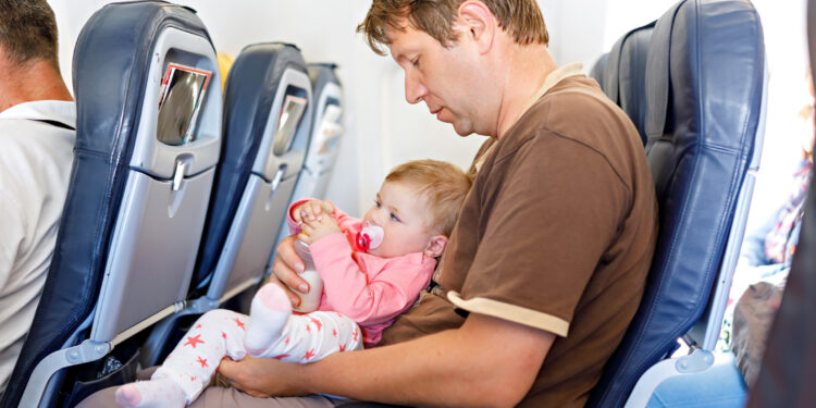 Should Airlines End Lap Children Policies Eye Of The Flyer   Parent Holding Child Lap Child Airline 750x375 