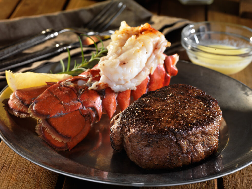 filet mignon steak with lobster tail surf and turf meal with deep focus