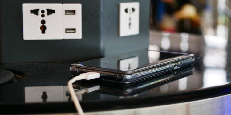 a cell phone charging on a table