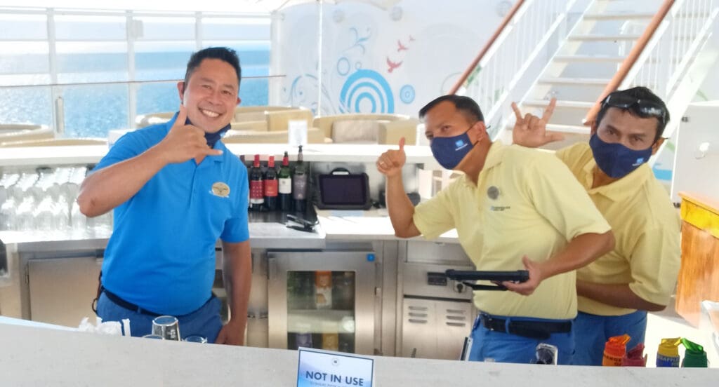 two men standing in front of a counter