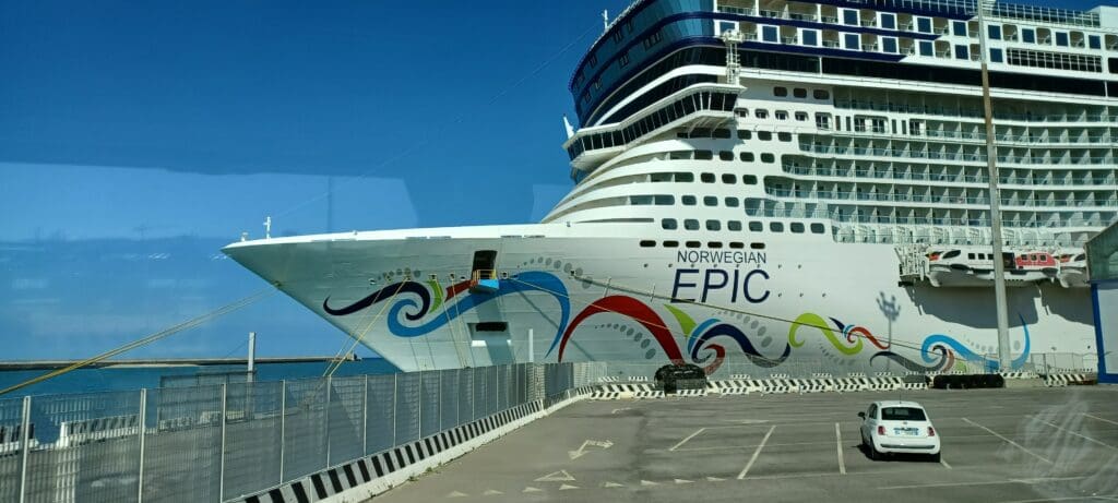 a cruise ship docked at a dock