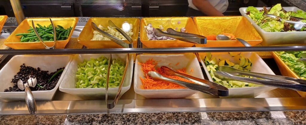 a row of bowls with food in them