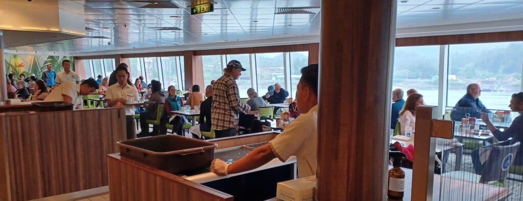 a group of people sitting at tables in a restaurant