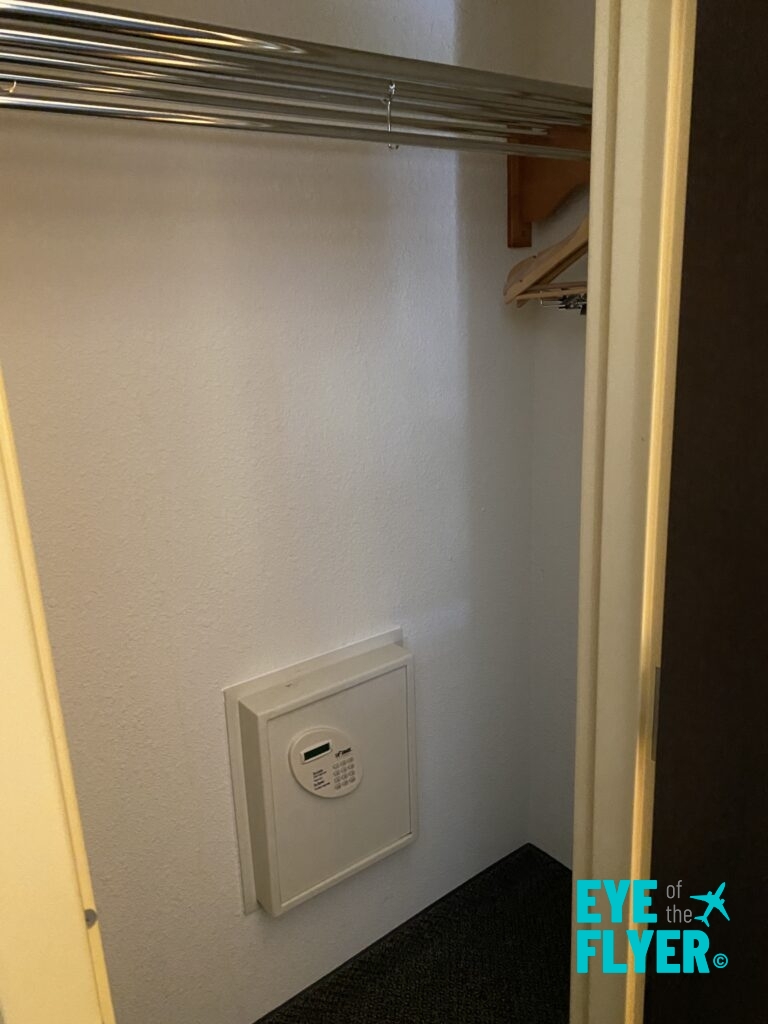 a closet with a small white box