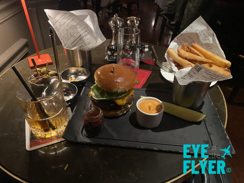 a burger and fries on a table