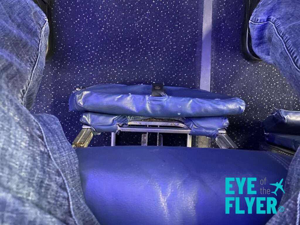 a blue chair in a plane