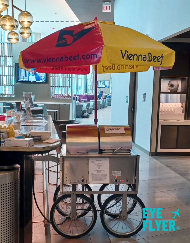 a food cart with an umbrella