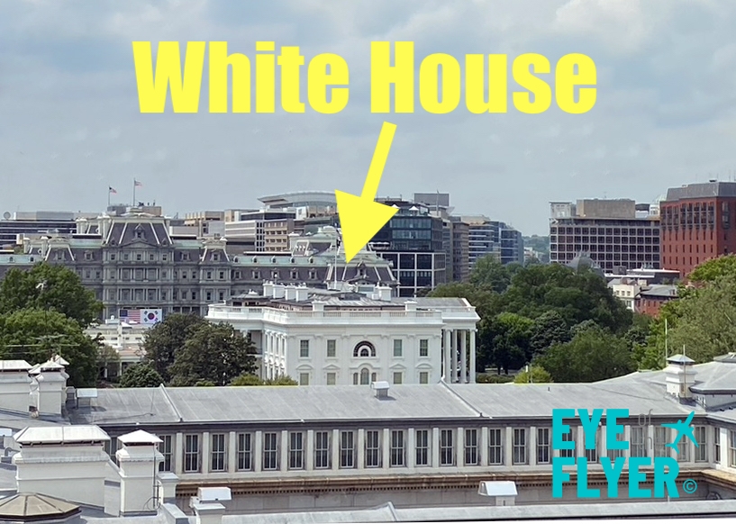 a white house with a yellow arrow pointing to the top