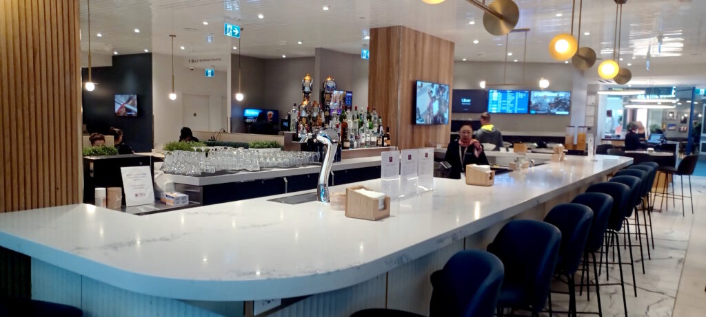 a bar with a counter and a group of people
