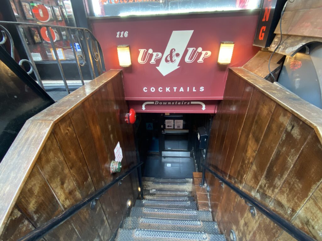 a staircase leading to a bar