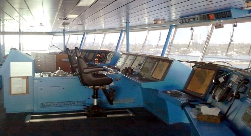 a large control room with many monitors