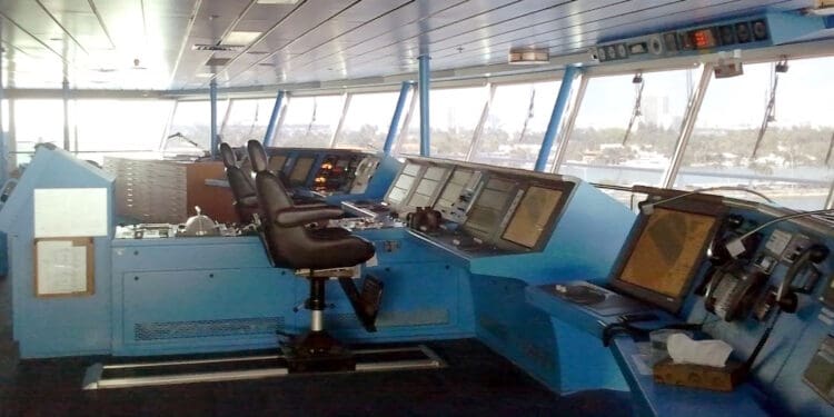 a large control room with many monitors