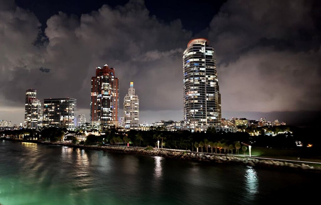 a city skyline with a body of water