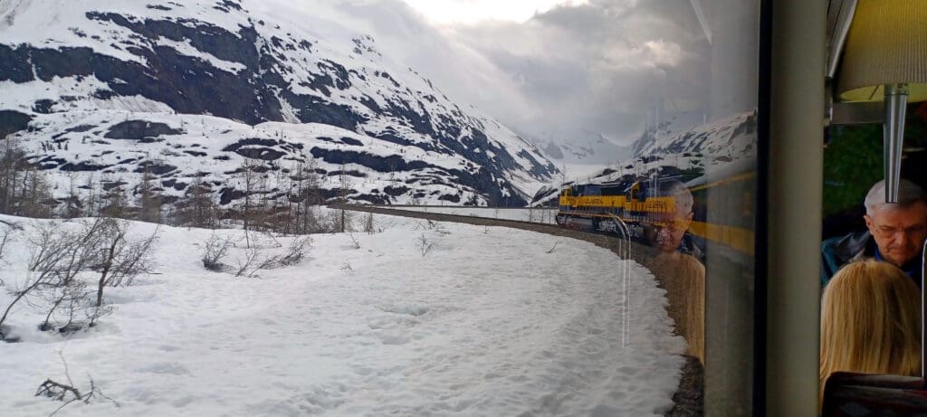 a train on the tracks in the snow