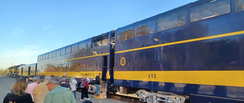 a group of people boarding a train