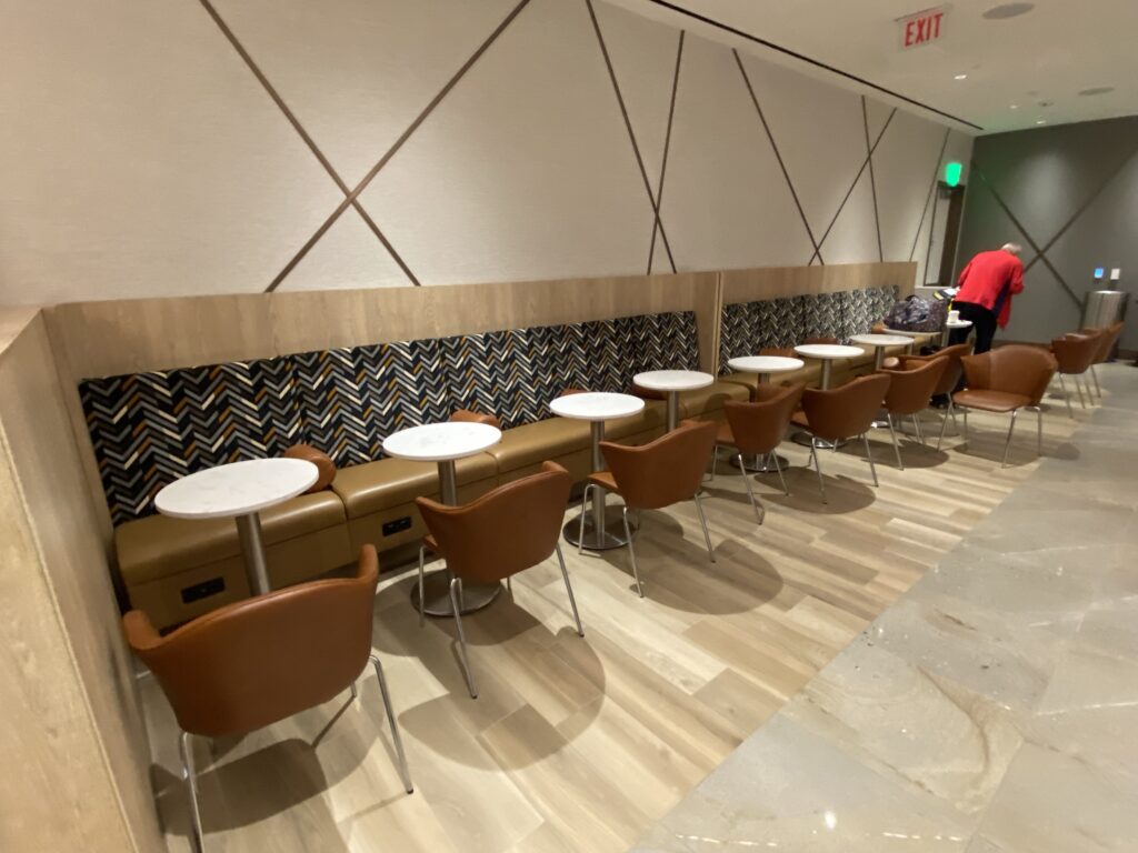 a row of tables and chairs in a restaurant