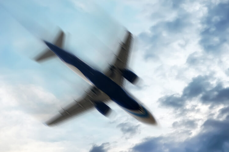 aerophobias concept. plane shakes during turbulence flying air hole. Blur image commercial plane moving fast downwards. Fear of flying. collapse slump, depression, downfall, debacle, subsidence, trip.