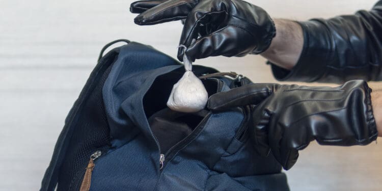 Police finding drugs in luggage.