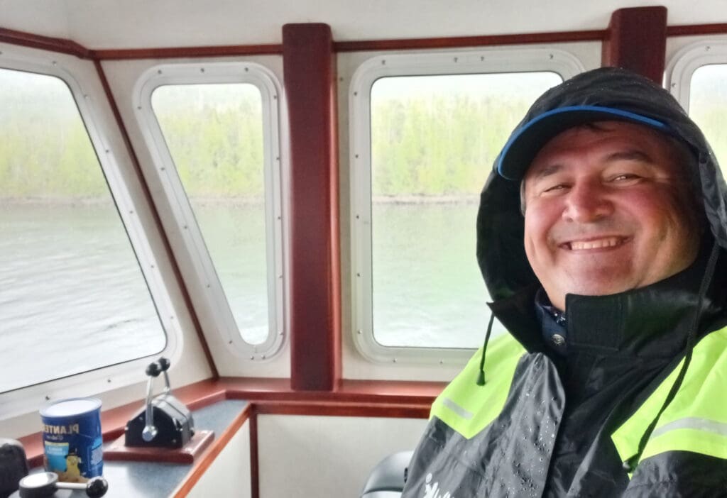 a man smiling in a boat