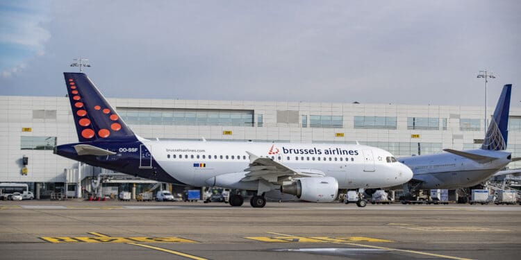 a group of airplanes on a runway