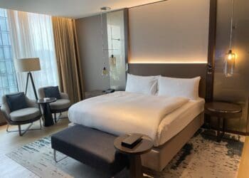a bed with a bed and a table in a room