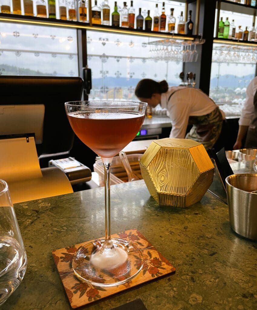 a glass of liquid on a counter