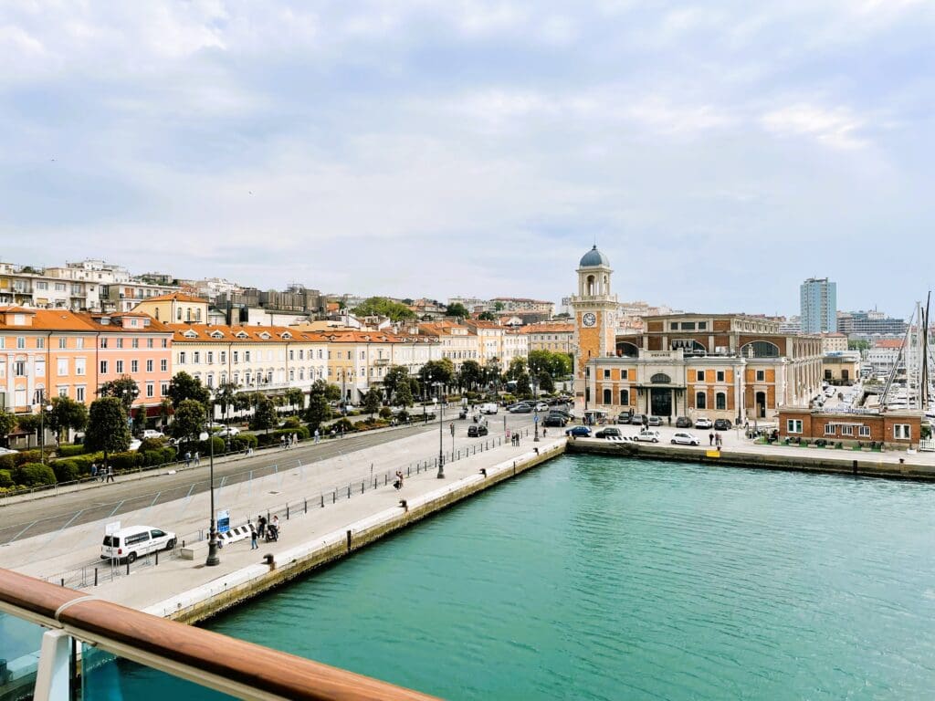 a water way with buildings and a clock tower