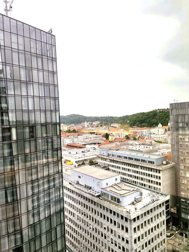 a group of buildings with trees in the background