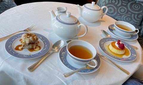 a table with tea and desserts