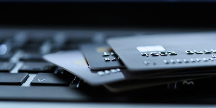 Close up shot of credit card on Laptop computer payment for purchases from online stores and online shopping. Concept of internet purchase. Selective focus for background