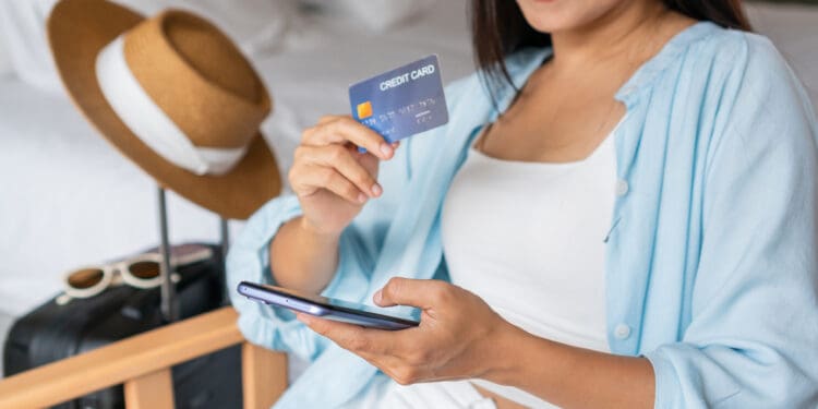 Business woman holding a credit card
