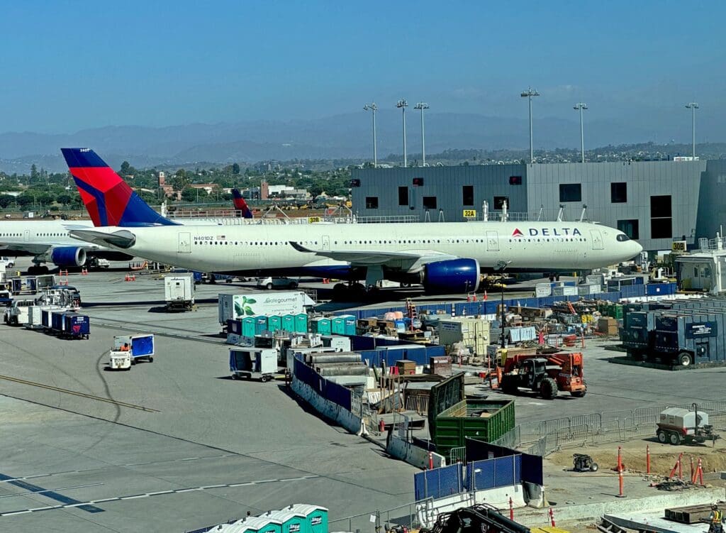 A Delta Air Lines Airbus A330-941, tail number N401DZ, is seen parked at Los Angeles International Airport (LAX). This image was taken from the T3-Tom Bradley International Terminal (TBIT) connector.