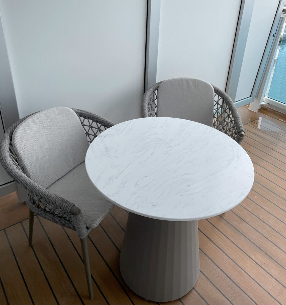 a table and chairs on a deck