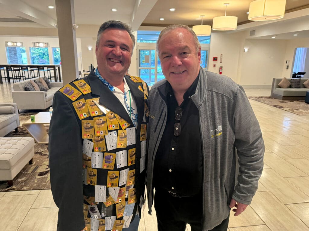 René de Lambert and United Airlines 23 million miler Tom Stuker pose during the 13th Annual Chicago Seminars on October 14, 2023, at Delta Hotels by Marriott Chicago Willowbrook in Willowbrook, Illinois.