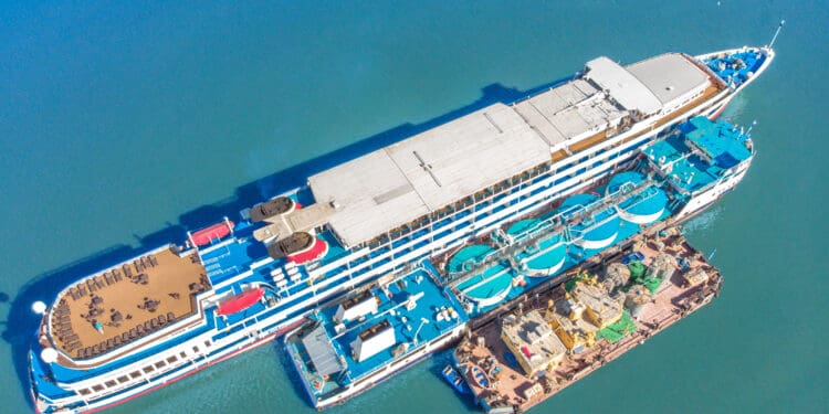 Refueling at sea - Small Oil products ship fuelling a large Bulk carrier, aerial image. top shot