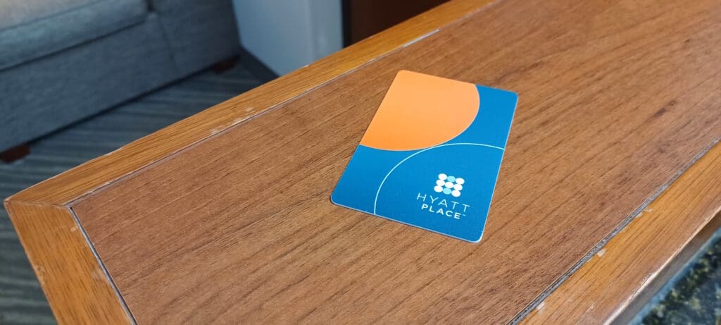 a blue and orange card on a wood surface